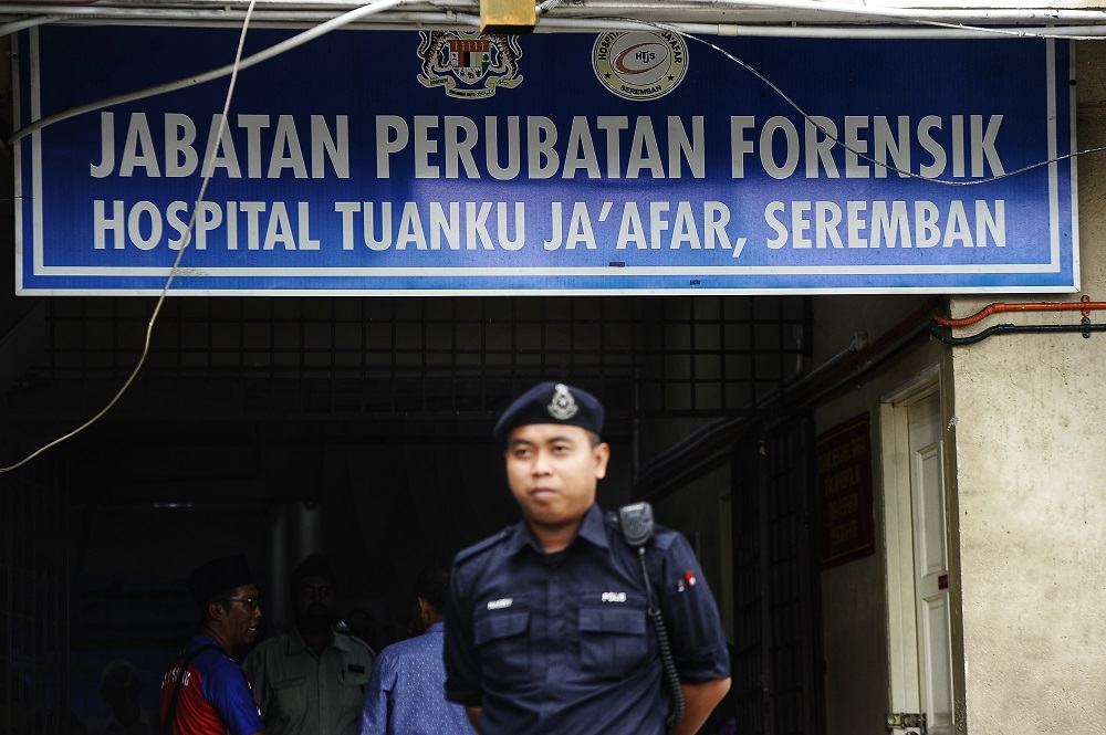 Police personnel are seen outside the Tuanku Ja’afar Hospital in Seremban August 15, 2019. — Picture by Shafwan Zaidon