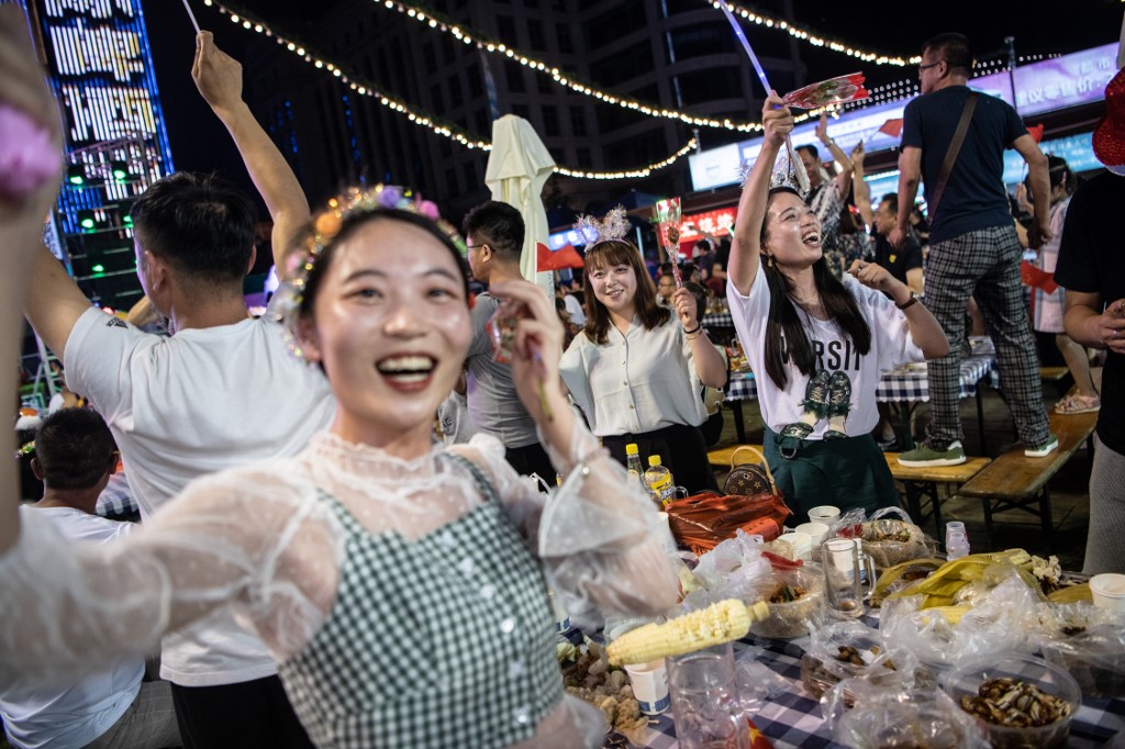 In this photo taken on August 3, 2019, people take part in the annual Qingdao Beer Festival in China's eastern Shandong province. u00e2u20acu201d AFP picnn