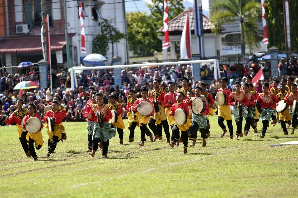 Performers take part in the Rapa'i Geleng dance, using a traditional tambourine, to celebrate Indonesia's 74th Independence Day in Blang Pidie, Aceh province on August 17, 2019. u00e2u20acu201du00c2u00a0AFP pic