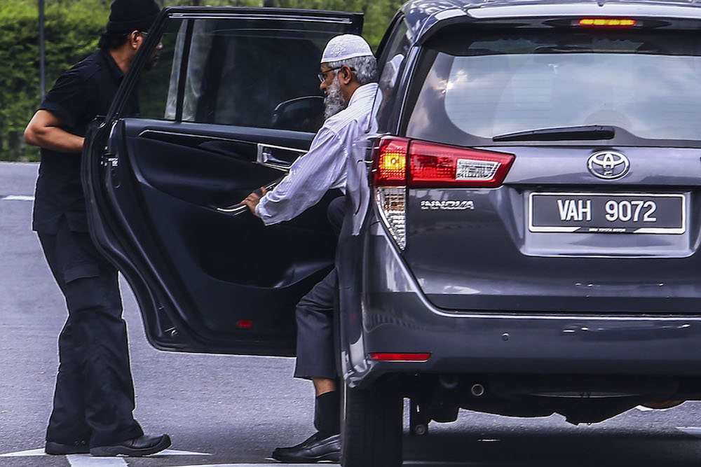 Dr Zakir Naik arrives at Bukit Aman police headquarters in Kuala Lumpur August 22, 2019. u00e2u20acu201d Picture by Hari Anggara