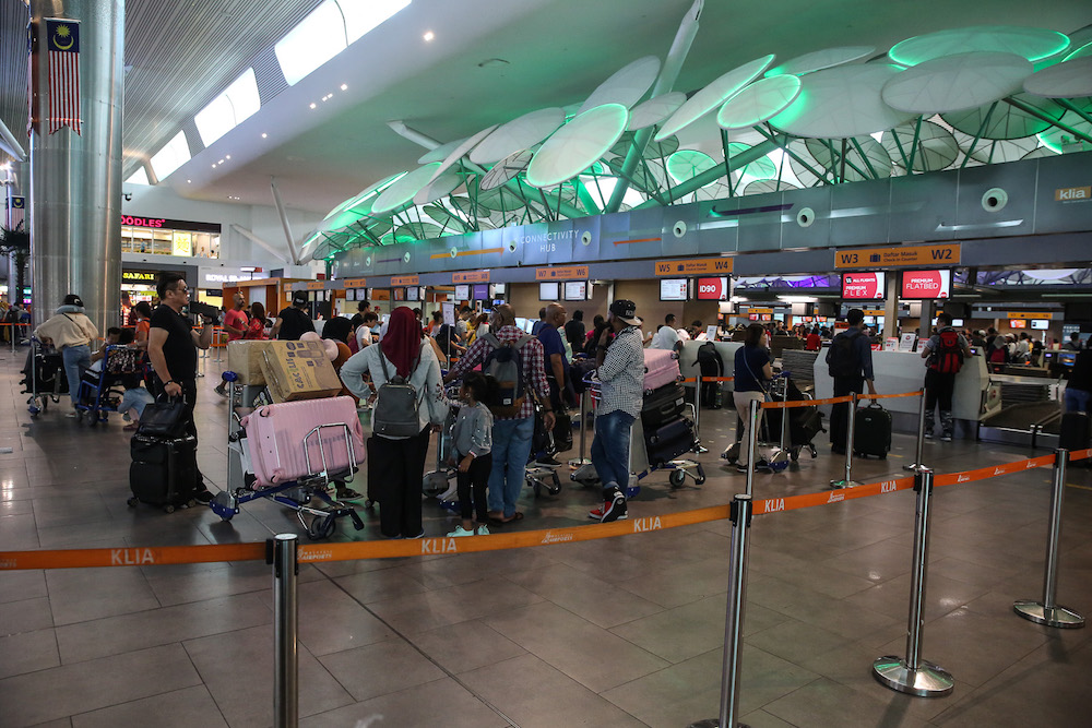 Passengers are seen at KLIA2 in Sepang August 22, 2019, during a systems outage. u00e2u20acu201d Picture by Yusof Mat Isa