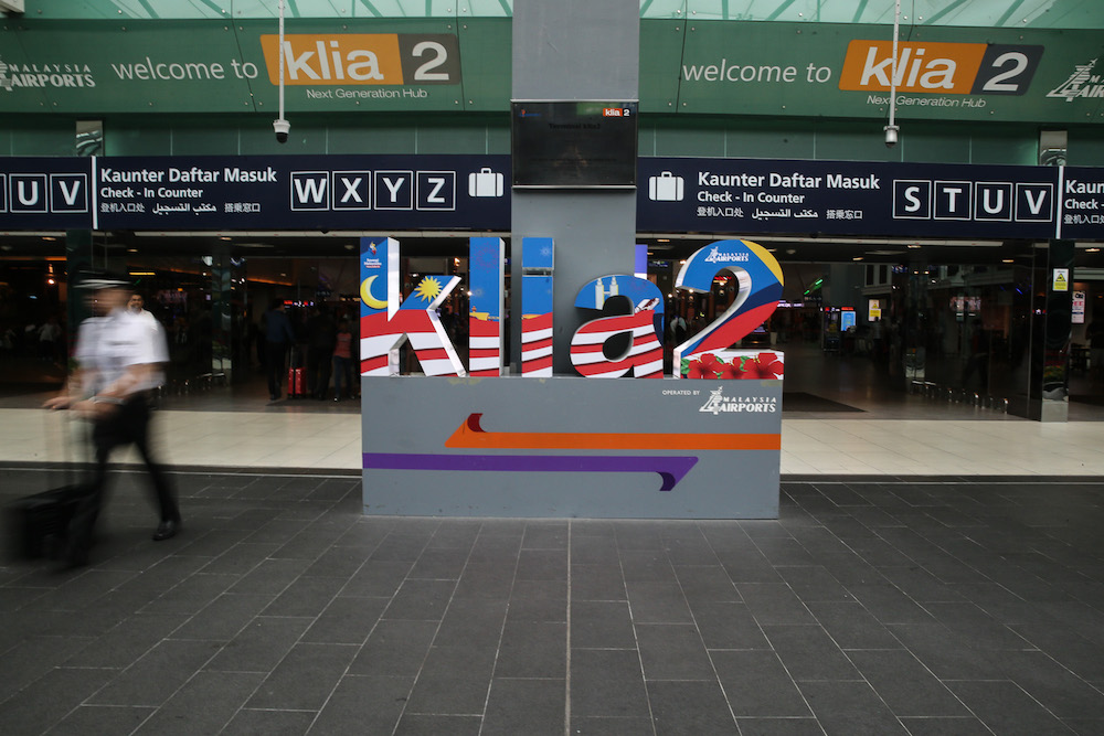 A man walks past a KLIA2 display in Sepang August 22, 2019. u00e2u20acu201d Picture by Yusof Mat Isa