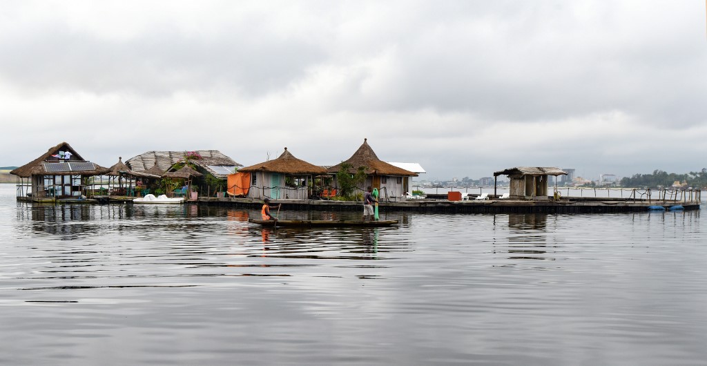In this file photo taken on August 6, 2019 fishermen work next to an artificial island made with around 700 000 recycled plastic waste collected in the surrounding area, on the Ebrie Lagoon in Abidjan. u00e2u20acu201d AFP picnn