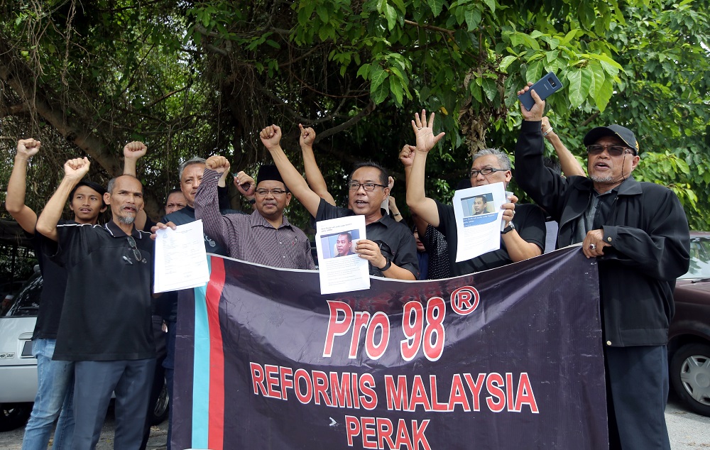 Members of six non-governmental organisations are seen gathering outside the Ipoh district police headquarters August 26, 2019. u00e2u20acu201d Picture by Farhan Najib 