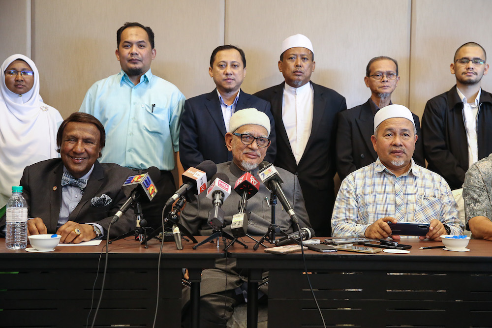 Tan Sri Abdul Jadir Sheikh Fadzir, Datuk Seri Abdul Hadi Awang and Datuk Seri Tuan Ibrahim attend a press conference in Putrajaya August 26, 2019. u00e2u20acu201d Picture by Yusof Mat Isa
