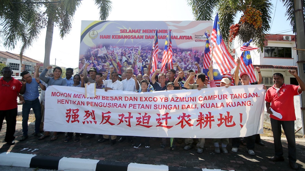 Four farmers from Kuala Kuang, Chemor, PSM chairman Dr Micheal Jeyakumar Devaraj and a group of supporters stage a protest in front of the Perak mentri besaru00e2u20acu2122s office in Ipoh August 27, 2019. u00e2u20acu201d Picture by Farhan Najib