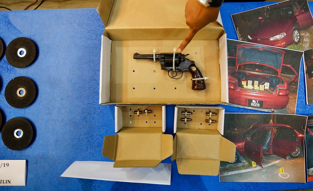 A revolver and other items seized during a shootout incident this morning are seen at the Penang police headquarters in George Town August 27, 2019. — Picture by Sayuti Zainudin 