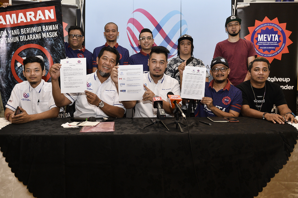 (From centre left) Malaysia Vape Chamber of Commerce executive secretary Datuk Mohd Mustaffa Hamzah, president Syed Azaudin Syed Ahmad and Mevta president Rizeni Zakaria during a press conference in Kuala Lumpur August 28, 2019. u00e2u20acu201d Picture by Miera Zulya