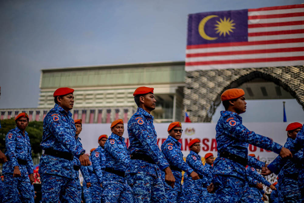 Malaysia Civil Defence Force personnel march during a National Day rehearsal in Putrajaya August 29, 2019. u00e2u20acu201d Picture by Firdaus Latif