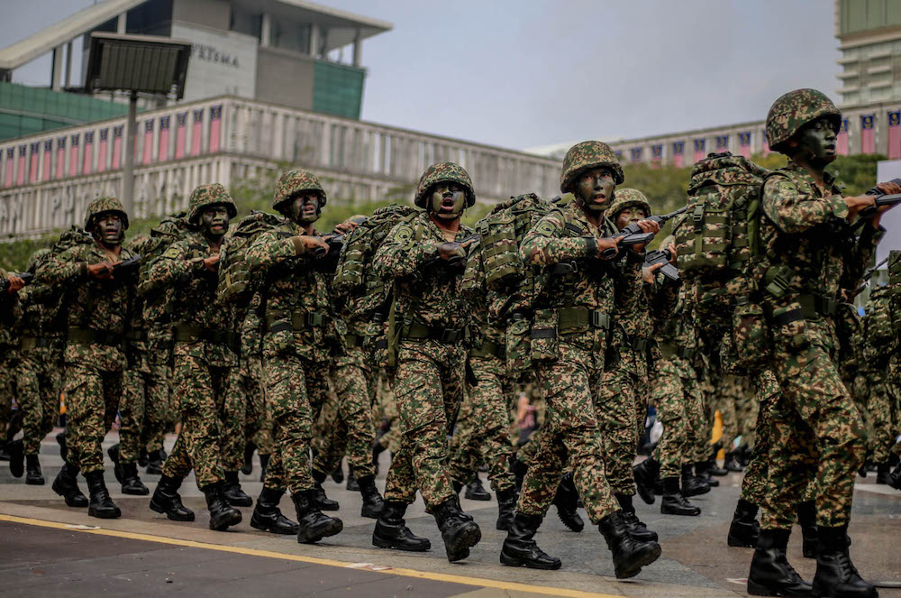 Malaysian Armed Forces personnel march during a National Day rehearsal in Putrajaya August 29, 2019. u00e2u20acu201d Picture by Firdaus Latif