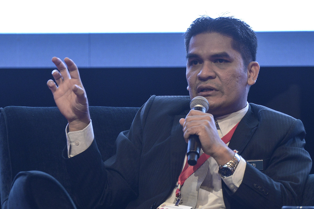 Deputy Economic Affairs Minister Radzi Jidin speaks during the National Economic Forum 2019 in Kuala Lumpur August 29, 2019. u00e2u20acu201d Picture by Shafwan Zaidon