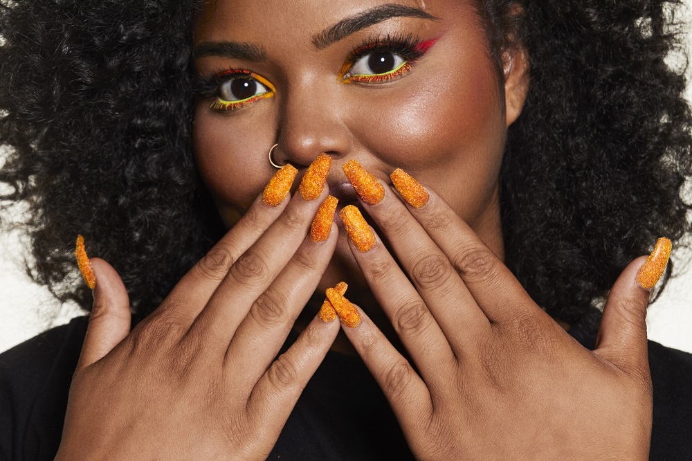 Cheetos puts its orange-dusted fingerprints all over the fashion and beauty world with u00e2u20acu02dcHouse of Flaminu00e2u20acu2122 Hauteu00e2u20acu2122. u00e2u20acu201d Picture courtesy of Frito-Lay / Cheetos