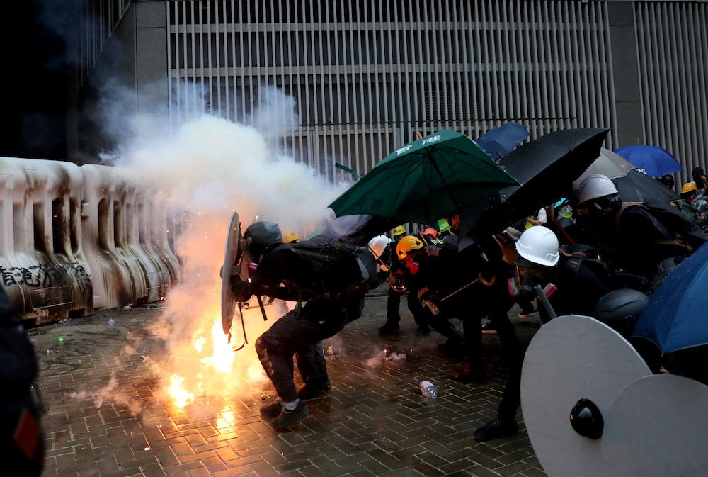 Demonstrators take cover during a protest in Hong Kong August 31, 2019. u00e2u20acu201d Reuters pic
