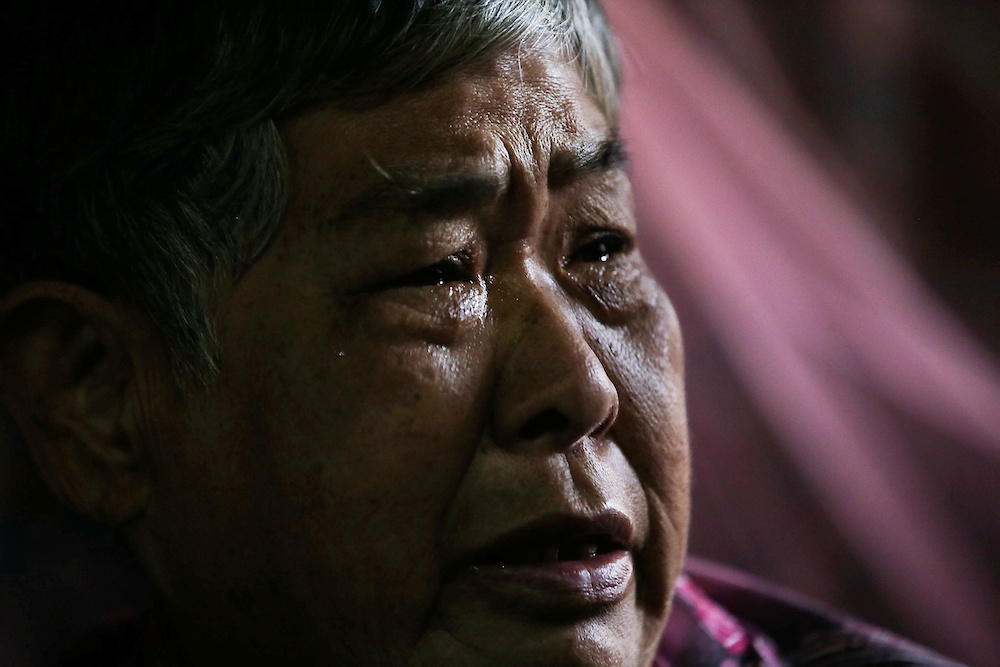 A tearful Ng Kwai Yee relates how she would take the bus from her home at Gunung View to their family home in Falim. — Picture by Farhan Najib