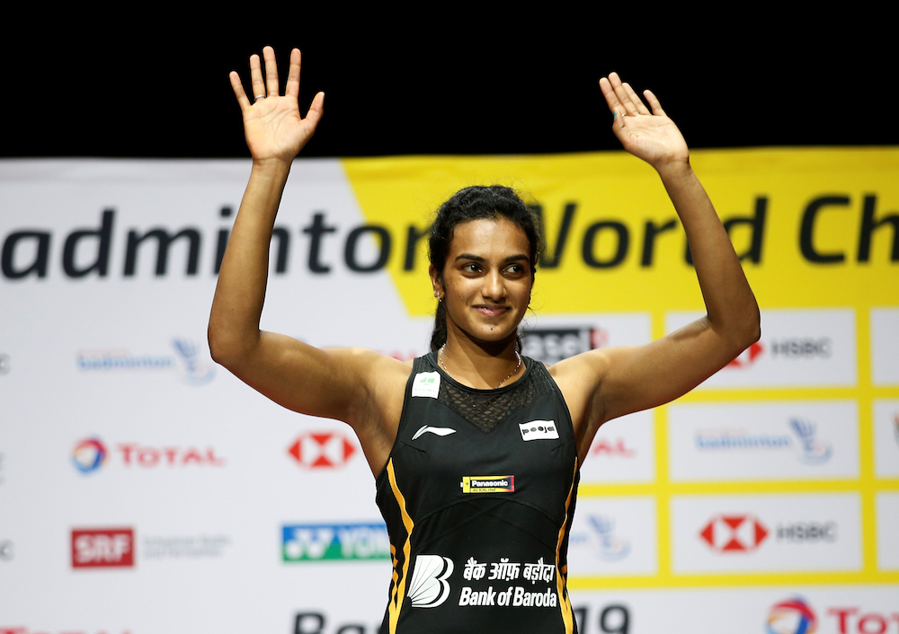 India's Pusarla Sindhu celebrates on the podium after winning the women's singles final in Basel August 25, 2019. u00e2u20acu201d Reuters pic