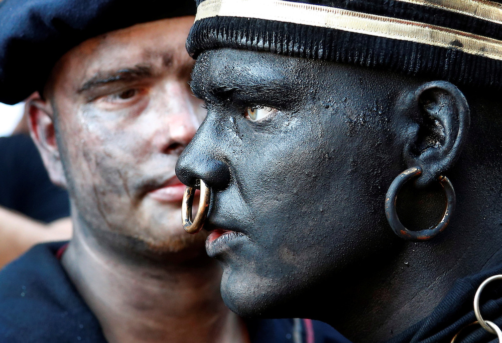 u00e2u20acu02dcThe Savageu00e2u20acu2122, a white performer in a blackface disguise, takes part in the festival Ducasse d'Ath, in the western town of Ath, Belgium August 25, 2019. u00e2u20acu201d Reuters pic