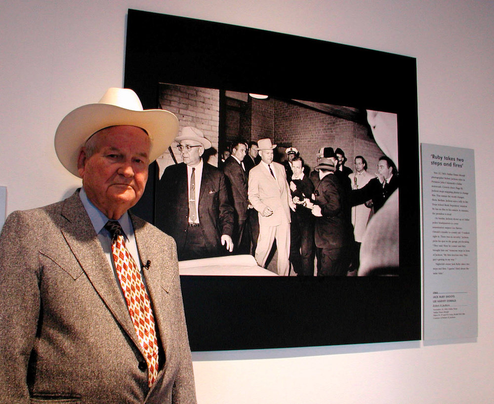 Former Dallas police detective Jim Leavelle stands in front of a Pulitzer Prize winning photo at The Sixth Floor Museum in Dallas, Texas October 15, 2002. u00e2u20acu201d Reuters pic