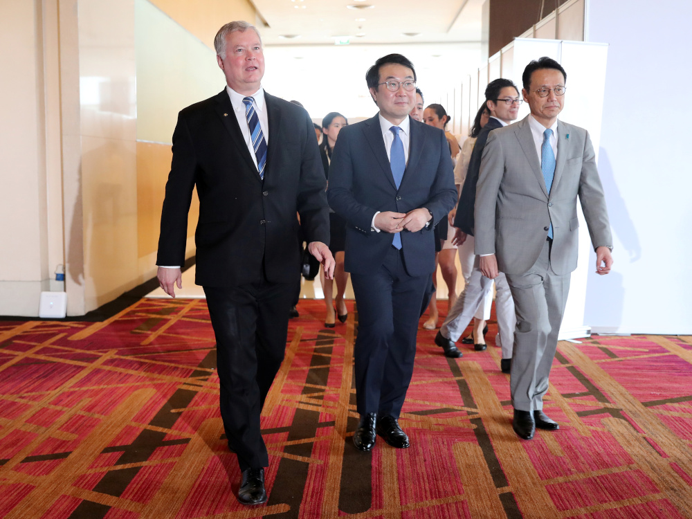 Respective special envoys for North Korea, US negotiator Stephen Biegun, South Korean negotiator Lee Do-hoon and Japanu00e2u20acu2122s negotiator Kenji Kanasugi, walk together at the media centre during the Asean and East Asia summits in Bangkok, Thailand, August 2, 