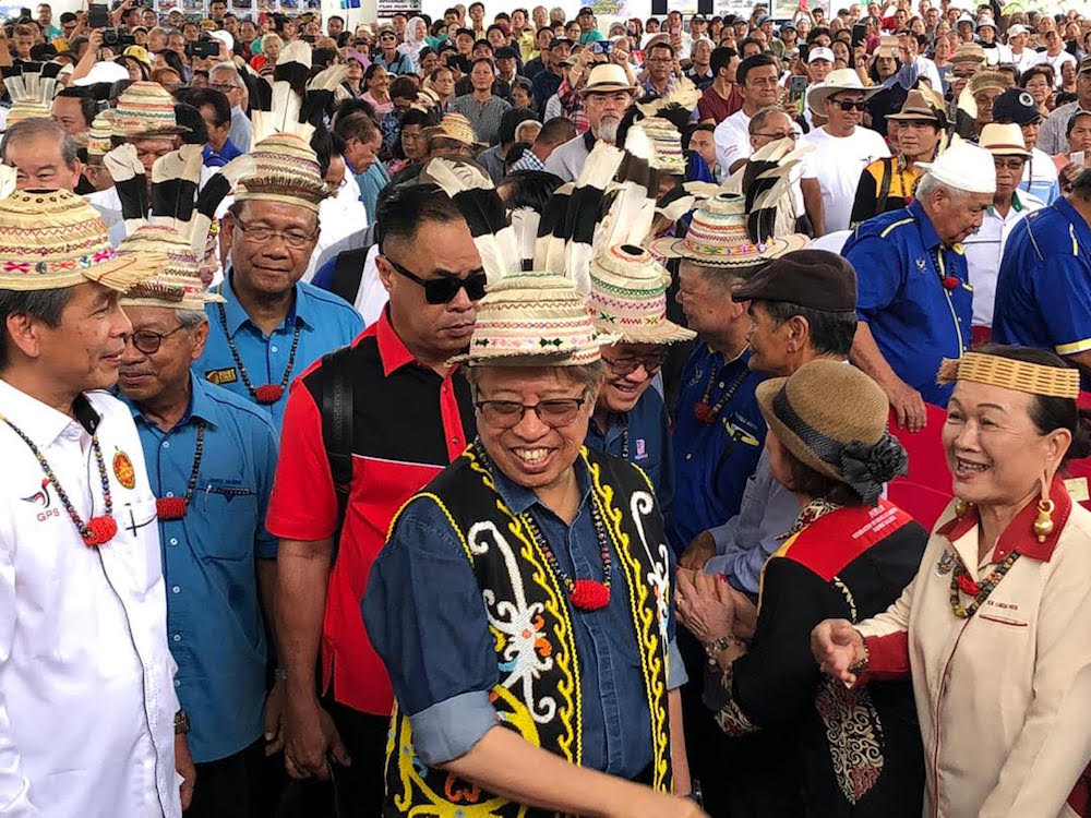 Chief Minister Datuk Patinggi Abang Johari Openg (foreground) is welcomed by a large crowd on arrival at Long Lama, about 120km from Miri, August 8, 2019. u00e2u20acu201d Picture courtesy of Chief Ministeru00e2u20acu2122s Office.