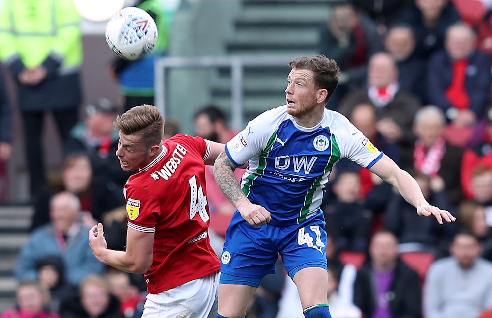 Wigan Athleticu00e2u20acu2122s Joe Garner in action with Bristol Cityu00e2u20acu2122s Adam Webster at Ashton Gate Stadium in Bristol, April 6, 2019. u00e2u20acu201d Reuters pic