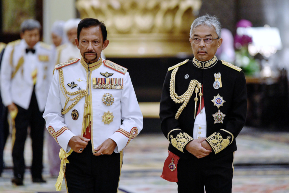 Yang di-Pertuan Agong Al-Sultan Abdullah Riu00e2u20acu2122ayatuddin Al-Mustafa Billah Shah and the Sultan of Brunei Sultan Hassanal Bolkiah on their way to the royal dinner in conjunction with His Majestyu00e2u20acu2122s installation as the 16th Yang di-Pertuan Agong July 31, 20