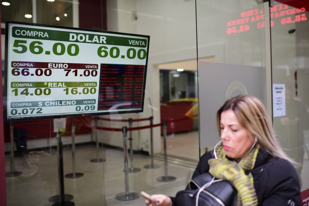 Currency exchange values are displayed on the buy-sell board of a bureau de exchange in Buenos Aires, on August 12, 2019. u00e2u20acu201d AFP pic