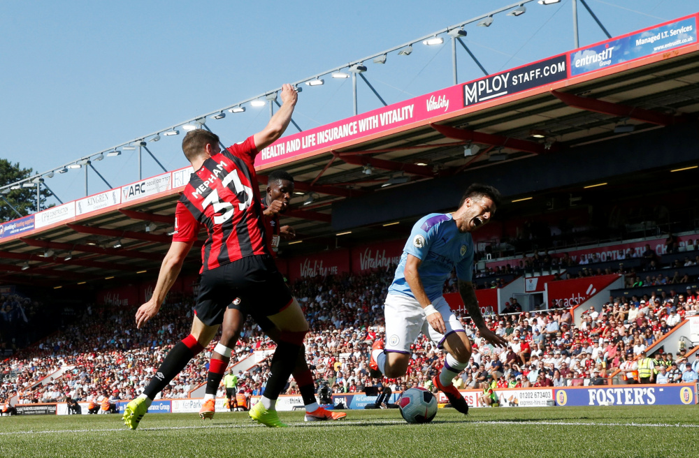 Bournemouthu00e2u20acu2122s Chris Mepham in action with Manchester Cityu00e2u20acu2122s David Silva during the AFC Bournemouth v Manchester City match at Vitality Stadium, Bournemouth, Britain August 25, 2019. u00e2u20acu201d Action Images via Reuters
