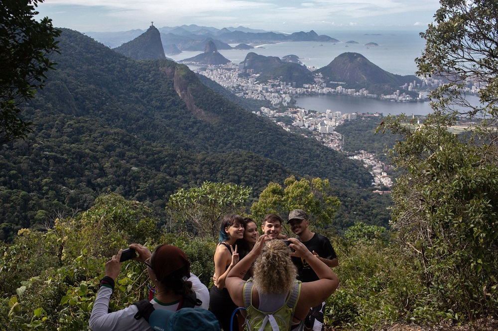 People take photos as they walk along a hiking trail u00e2u20acu201d part of a projected 8,000km trail across Brazil, which will be one of the longest in the Americas u00e2u20acu201d in Rio de Janeiro, Brazil July 21, 2019. u00e2u20acu201d AFP pic           