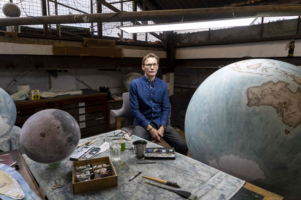 Artisan globemaker, Peter Bellerby poses for a photograph at the Bellerby and Co Globemakers’ workshop and headquarters in Stoke Newington in north London July 19, 2019. — AFP pic