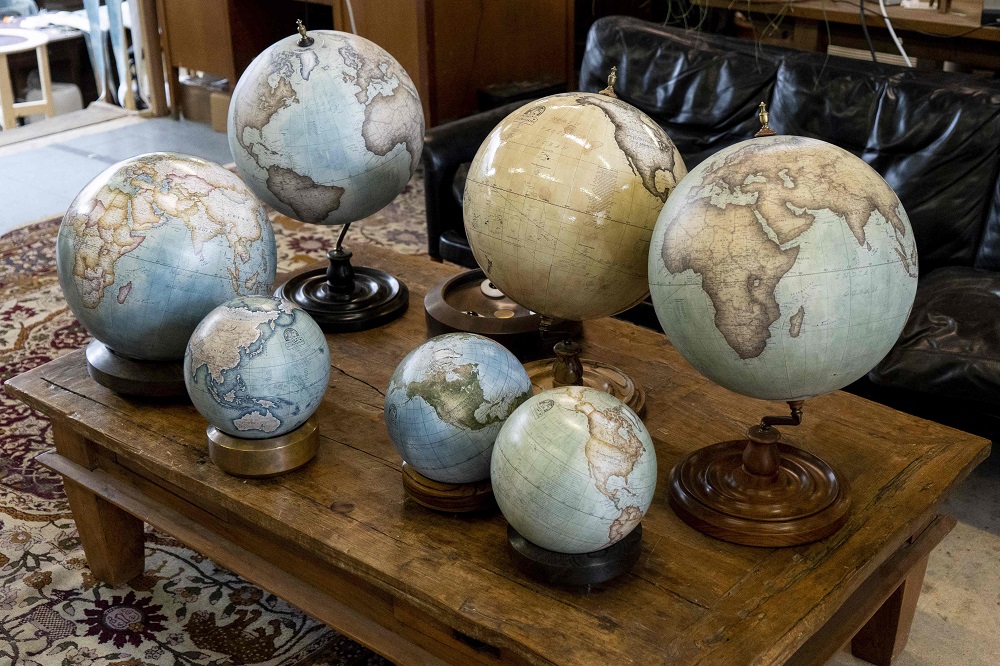 Globes are displayed at the Bellerby and Co Globemakersu00e2u20acu2122 workshop and headquarters in Stoke Newington in north London July 19, 2019. u00e2u20acu201d AFP pic        