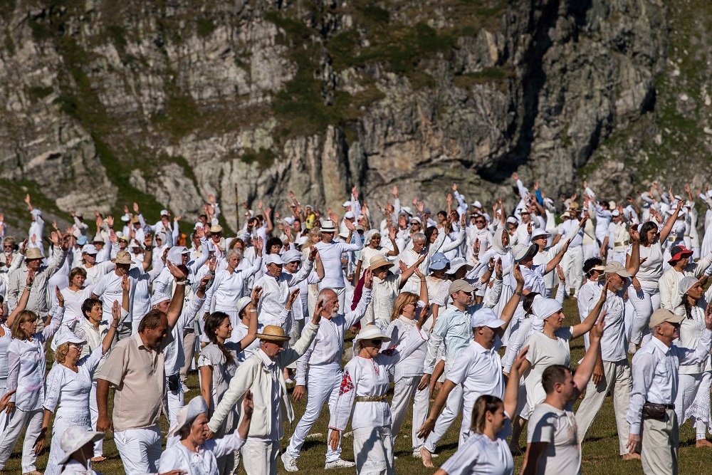 Members of an international religious movement called the Universal White Brotherhood perform a ritual dance on the top of the Rila Mountain, near Babreka lake, Bulgaria August 19, 2019. — AFP pic  