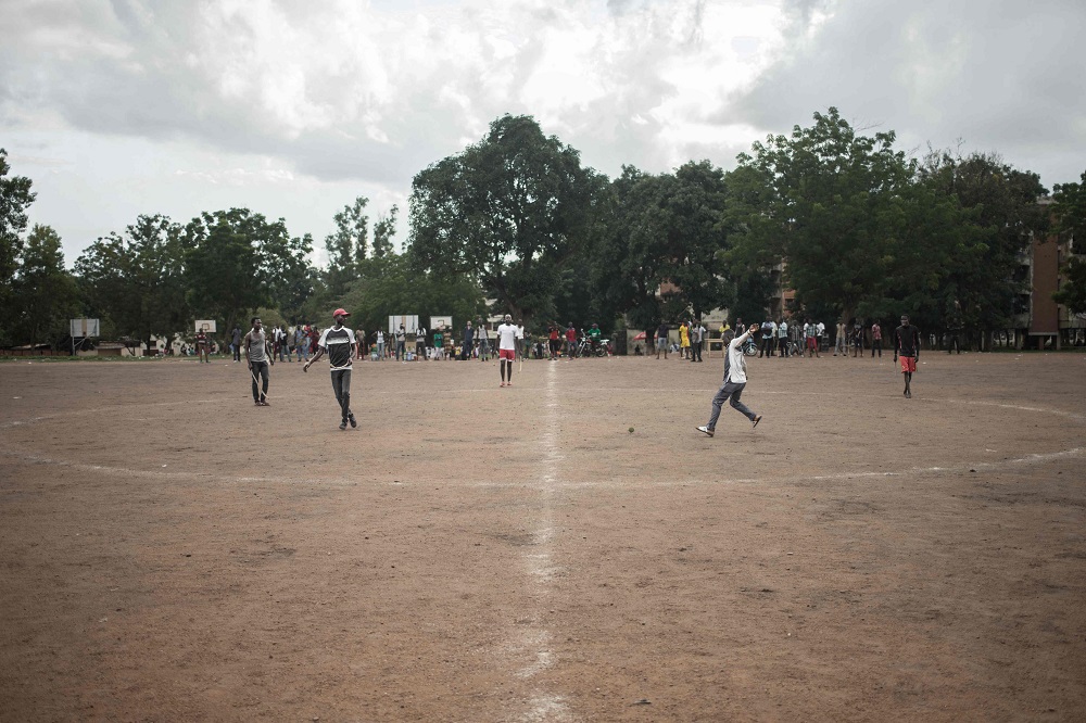 Ngbaba players compete for the puck on the field during a game in Bangui August 8, 2019. — AFP pic