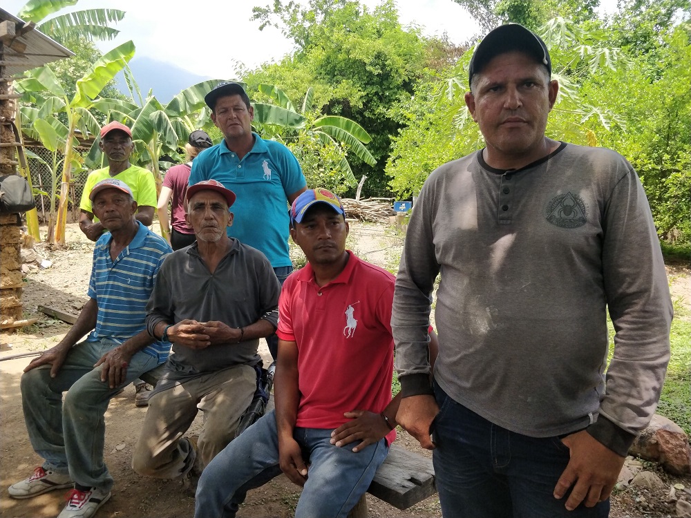 A group of Colombians who fled their homes in 2012 and 2013 due to armed conflict poses for the camera at their new pig farm in Fonseca municipality in northern Colombia June 6, 2019. u00e2u20acu201d Thomson Reuters Foundation