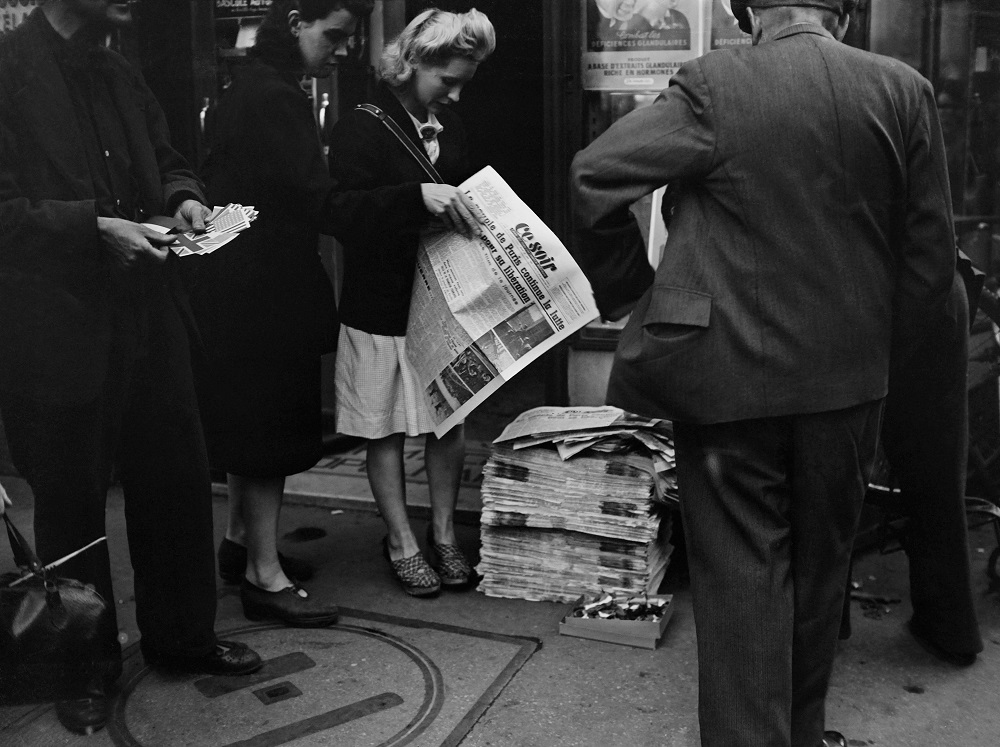 In this file photograph taken on August 22, 1944, Parisians buy newspapers during the battle for the liberation of Paris, during World War II. u00e2u20acu201d AFP pic          