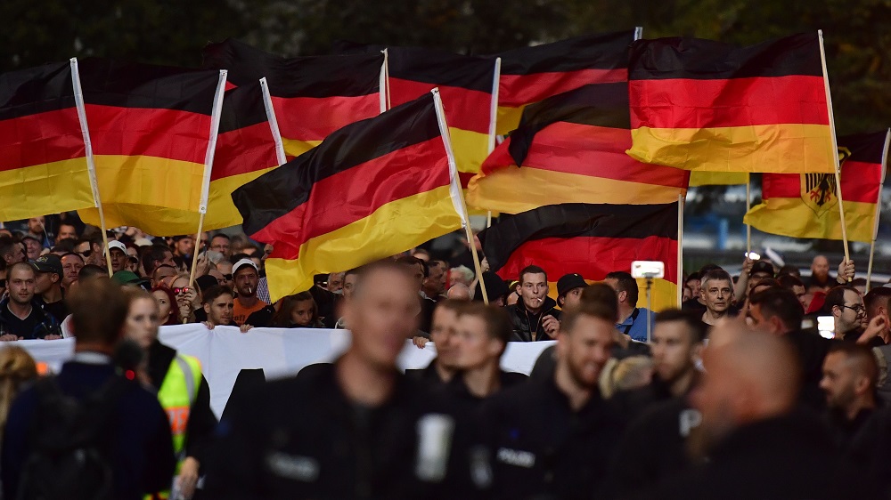 In this file photo taken on September 7, 2018, people hold national flags during a march organised by the right-wing populist u00e2u20acu02dcPro Chemnitzu00e2u20acu2122 movement, in Chemnitz. u00e2u20acu201d AFP pic 
