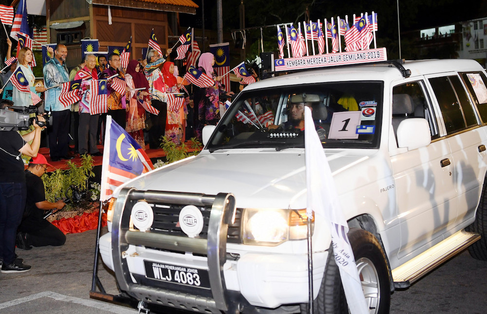 Communications and Multimedia Minister Gobind Singh Deo and Prime Minister Tun Dr Mahathir Mohamad at the launch of the National Month and Fly the Jalur Gemilang 2019 at Dataran Pahlawan in Melaka August 3, 2019. u00e2u20acu201d Bernama pic