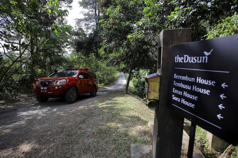 A vehicle from the Fire and Rescue Department’s K9 Unit leaves The Dusun in Kampung Baru Pantai, Seremban August 5, 2019. — Bernama pic