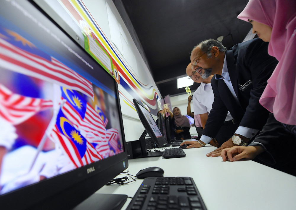 Communications and Multimedia Minister Gobind Singh Deo visits the internet centre at Kampung Padang Lalang in Mukim Ayer Hangat, Langkawi August 6, 2019. u00e2u20acu201d Bernama pic