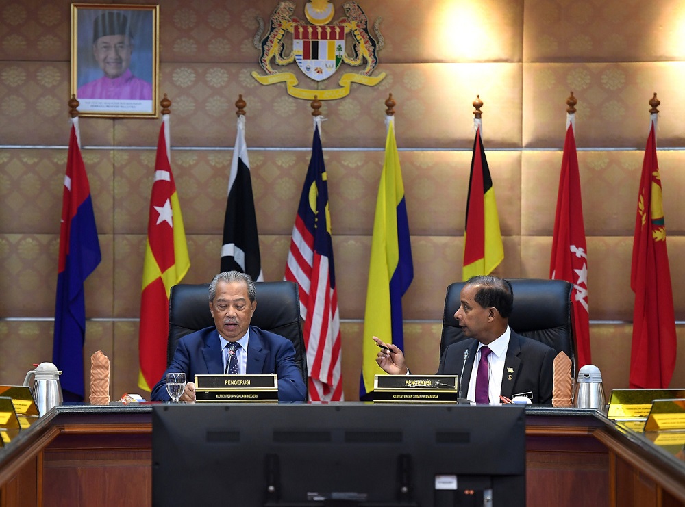 Home Minister Tan Sri Muhyiddin Yassin (left) and Human Resources Minister M. Kulasegaran during a meeting in Putrajaya August 8, 2019. -- Bernama pic