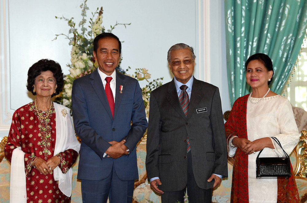(From left) Tun Dr Siti Hasmah Mohd Ali, Joko Widodo, Tun Dr Mahathir Mohamad and Iriana Joko Widodo pose for pictures in Putrajaya August 9, 2019. u00e2u20acu201d Bernama pic