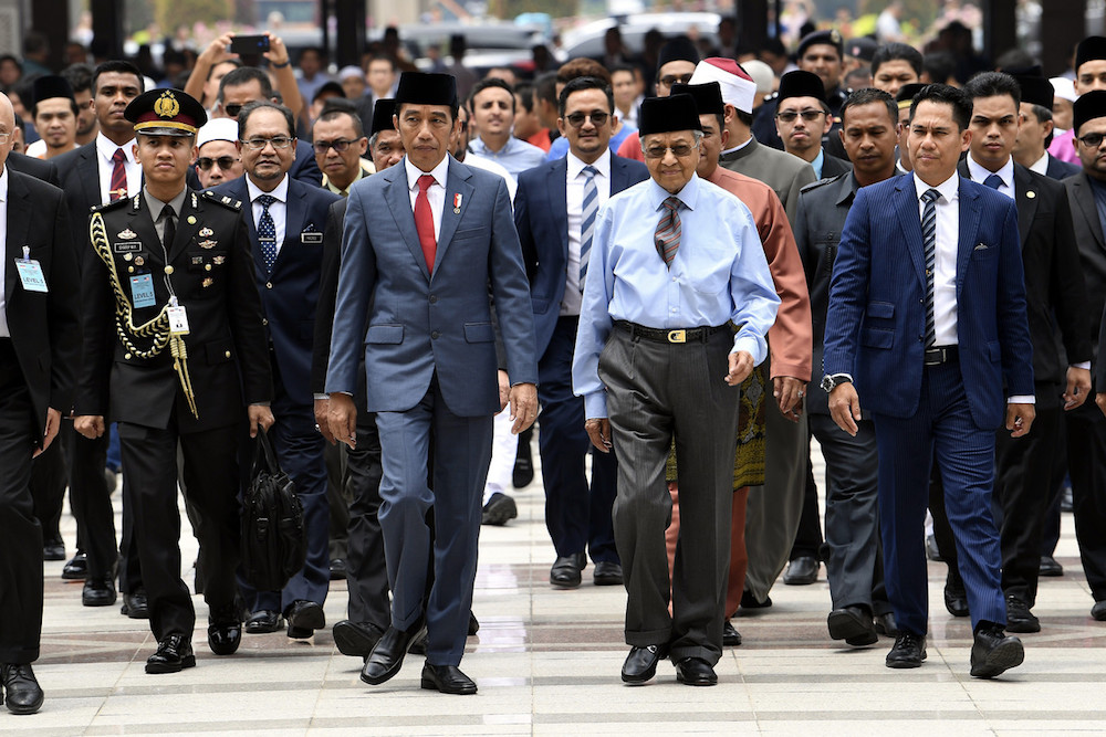Prime Minister Tun Dr Mahathir Mohamad and Indonesian President Joko Widodo attend Friday prayers at Putra Mosque in Putrajaya August 9, 2019. u00e2u20acu201d Bernama pic