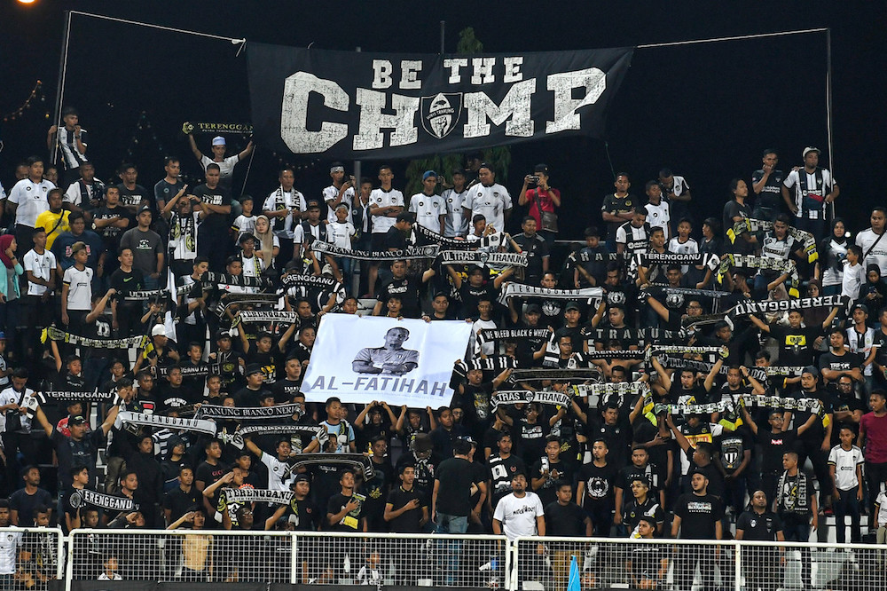 Terengganu FC fans hold banners in remembrance of goalkeeper Mohd Suffian Abd Rahman during the Malaysia Cup Group A match with Negri Sembilan in Kuala Terengganu August 17, 2019. u00e2u20acu201d Bernama pic