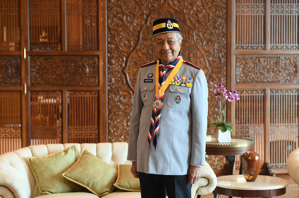 Prime Minister Tun Dr Mahathir Mohamad poses for pictures at his office in Putrajaya August 19, 2019, after being conferred with the Scouts Association of Malaysiau00e2u20acu2122s highest award, Anugerah Bintang Semangat Padi Kelas Pertama (Emas). u00e2u20acu201d Bernama pic