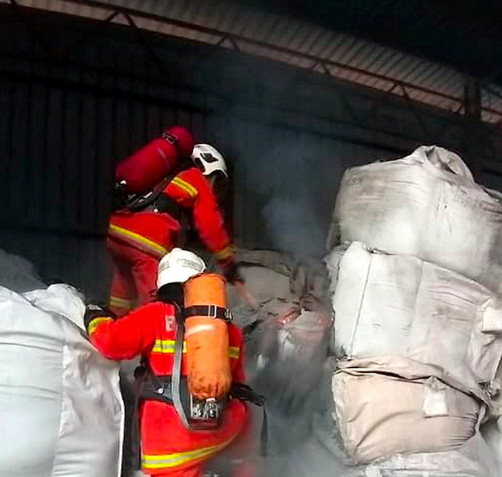 Fire and Rescue Department personnel work to put out a chemical waste fire in the Pontian Industrial Area August 22, 2019. u00e2u20acu201d Bernama pic