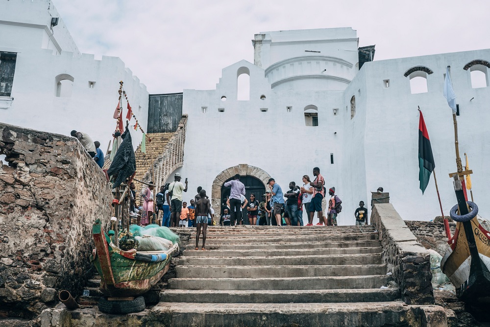 Visitors gather on August 18, 2019, at Cape Copast Castle, outside the u00e2u20acu02dcDoor of No Returnu00e2u20acu2122, through which enslaved Africans were loaded as cargo onto the ships that took them across the Atlantic to the Americas. u00e2u20acu2022 AFP pic          