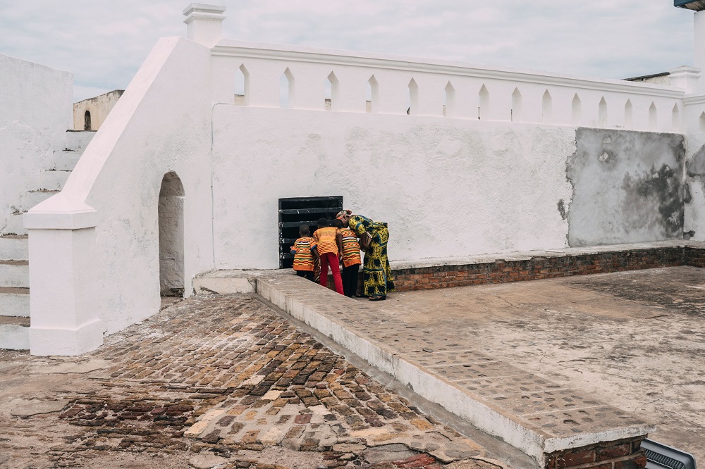 Tourists look inside the dungeons at the Cape Coast Castle August 18, 2019. ― AFP pic          