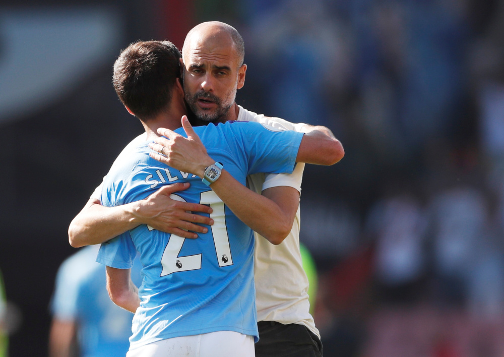 Manchester City manager Pep Guardiola hugs David Silva after the AFC Bournemouth v Manchester City match at Vitality Stadium, Bournemouth, Britain August 25, 2019. u00e2u20acu201d Action Images via Reuters  