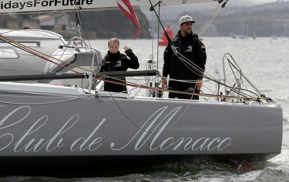 Swedish teenage climate activist Greta Thunberg waves from the Malizia II boat next to German yachtsman Boris Herrmann, as she starts her trans-Atlantic boat trip to New York, in Plymouth, Britain, August 14, 2019. u00e2u20acu201d Reuters pic