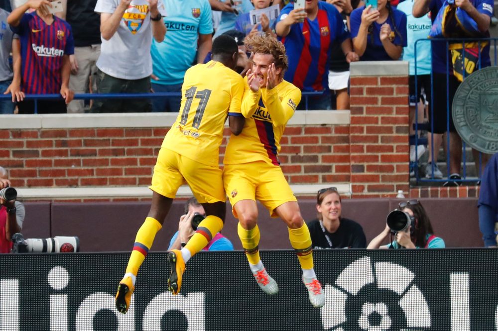 Barcelona forward Ousmane Dembele (11) celebrates his goal with Antoine Griezmann (17) against Napoli during a friendly match at the Michigan Stadium. u00e2u20acu201d Reuters pic