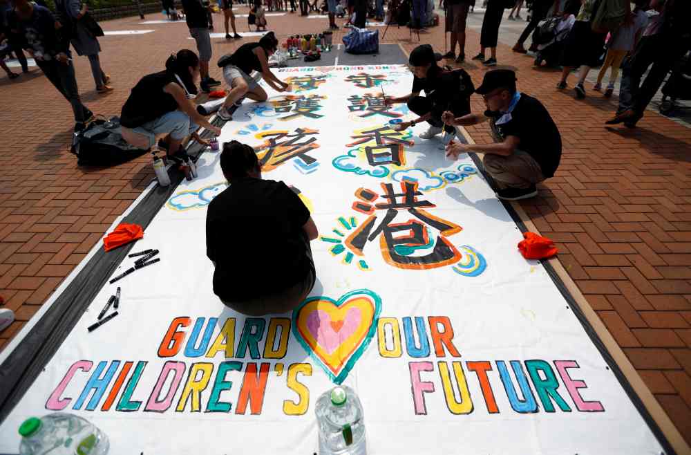 Protest members participate in a rally titled u00e2u20acu02dcGuard Our Children's Futureu00e2u20acu2122 at Edinburgh Place in Hong Kong August 10, 2019. u00e2u20acu2022 Reuters pic